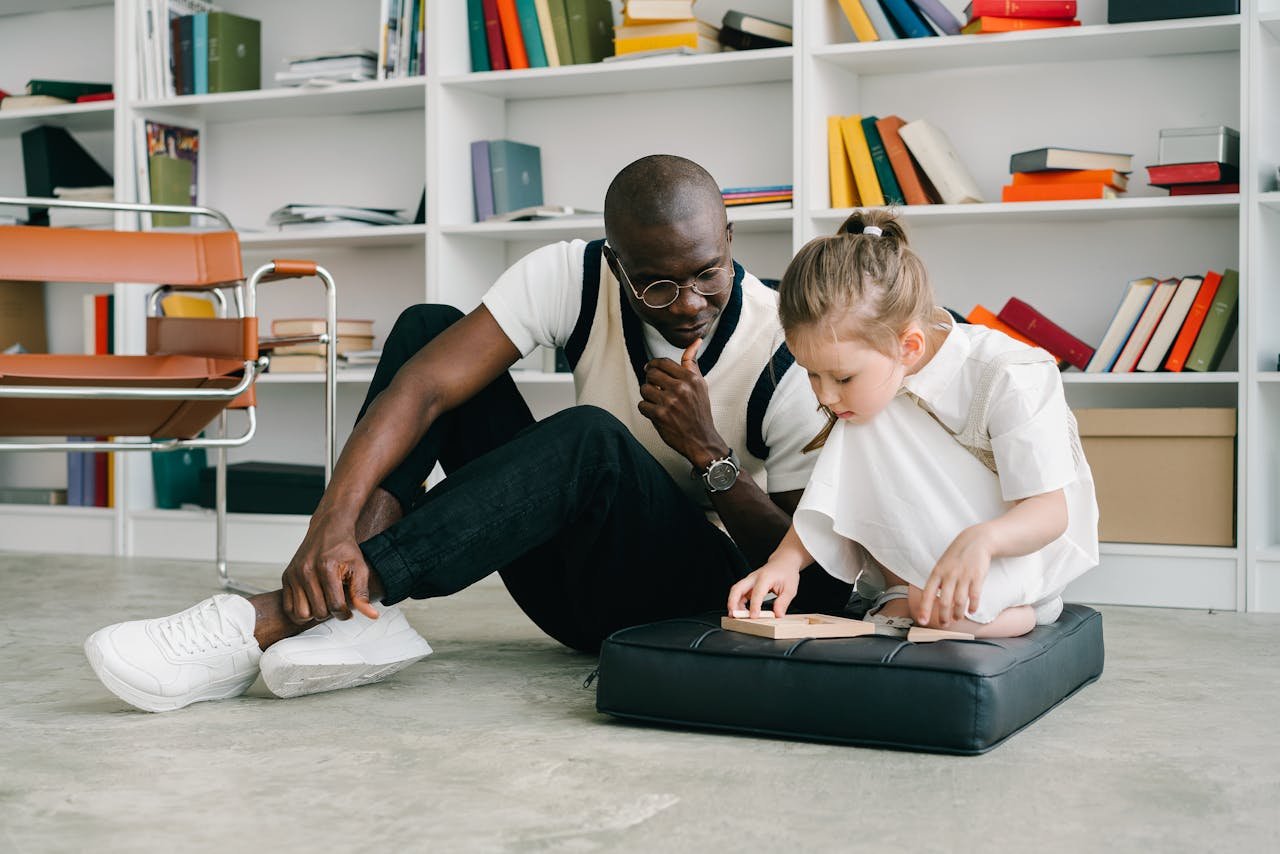 Psychologist and child in a thoughtful educational session indoors. Fostering learning and connection.